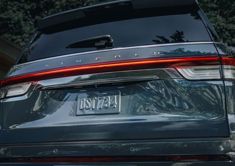 The wraparound rear lights of a Lincoln Navigator SUV are shown. | Ted Russell Lincoln in Knoxville TN