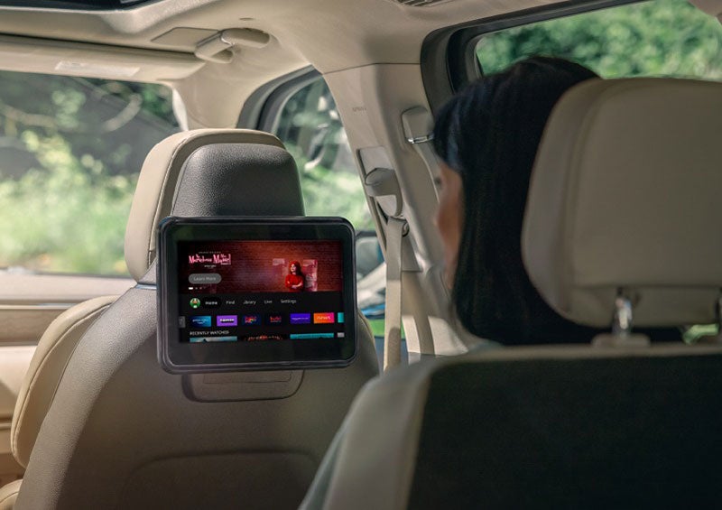 A person is seated in a 2023 Lincoln Nautilus SUV viewing an available entertainment screen. | Ted Russell Lincoln in Knoxville TN