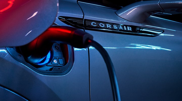 A charger plugged into the charging port of a 2024 Lincoln Corsair® Plug-in Hybrid model. | Ted Russell Lincoln in Knoxville TN